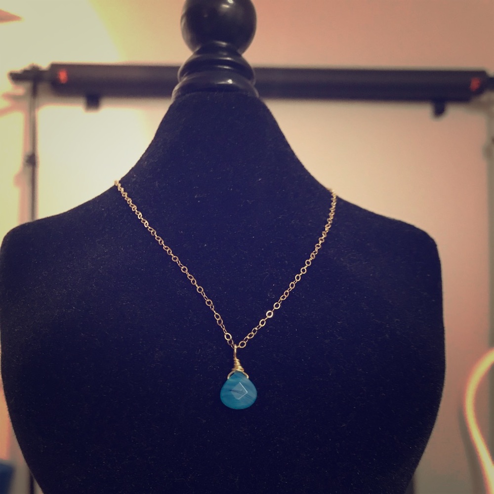 Hand made turquoise colored glass charm necklace